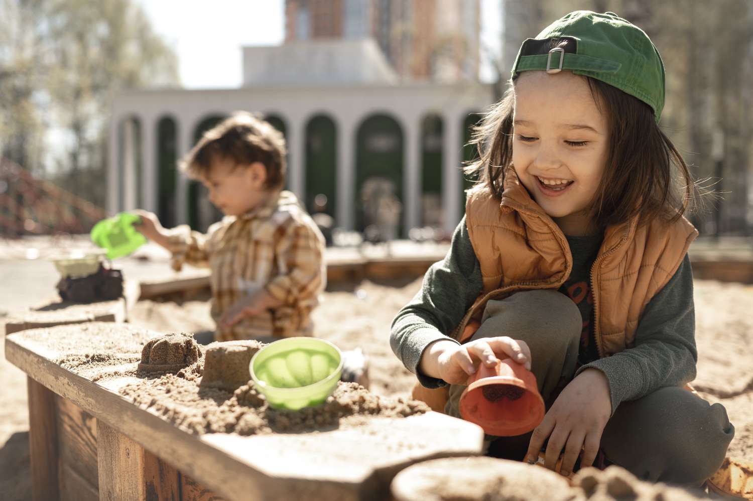 A parent and child bonding over sensory play activities with textured toys