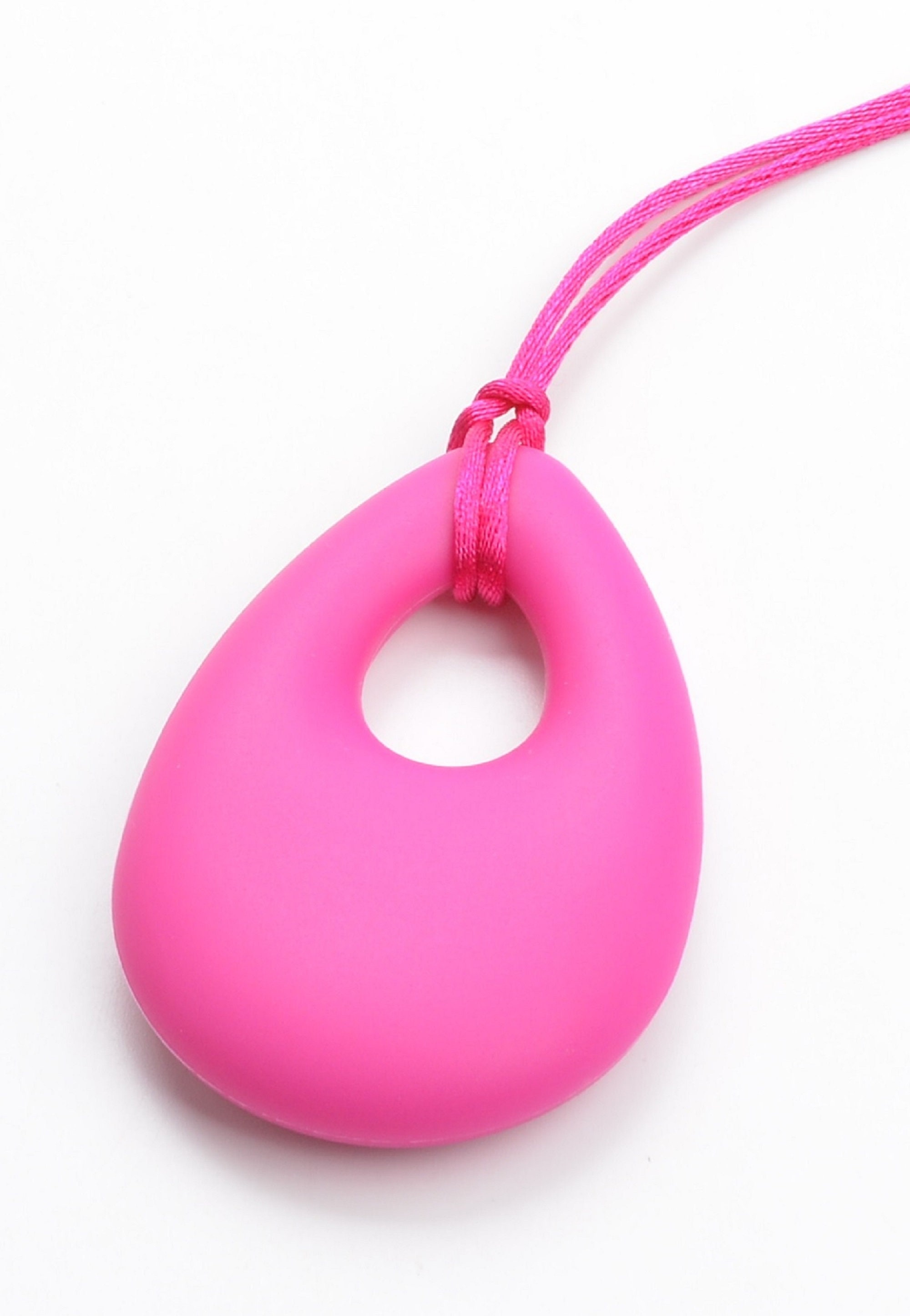 Close-up of wearable stim toys: a silicone chewelry necklace and a spinner ring