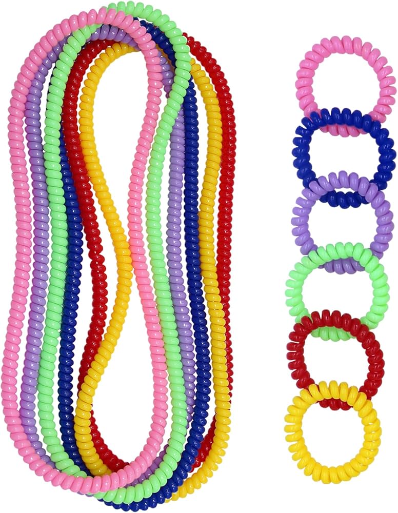 Assorted fidget toys and chewable jewelry on a mat