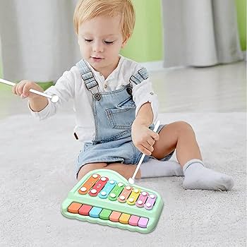 Child playing with colorful xylophone