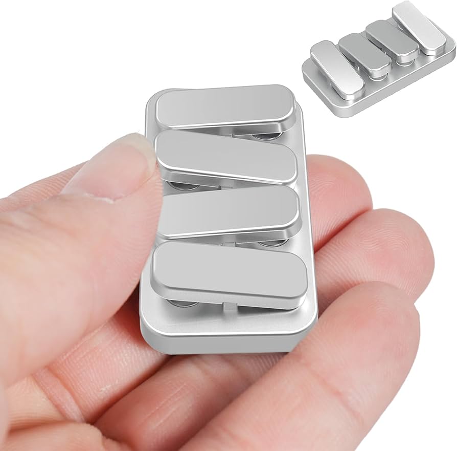 A multi-track metal fidget slider with magnetic clicks, shown in a hand