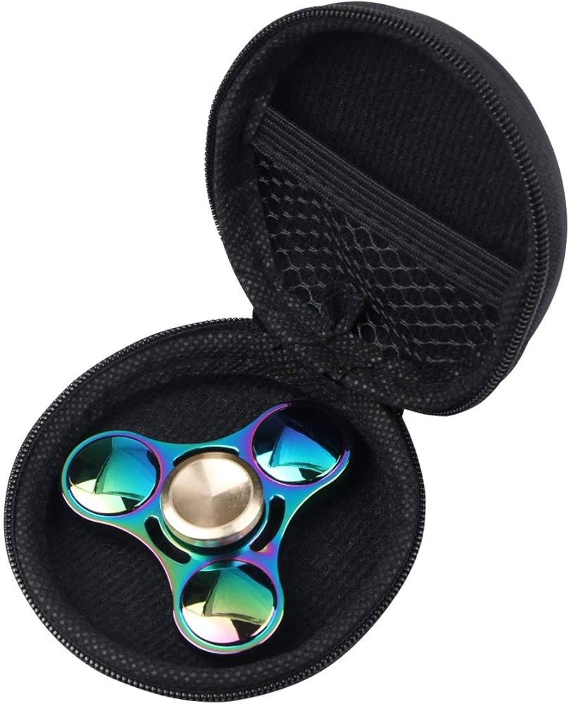 A metallic fidget spinner balanced on a finger