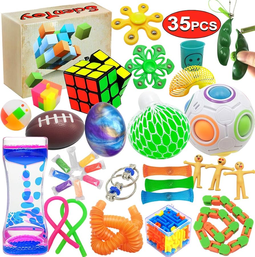 Various fidget toys including cubes, stones, and putty