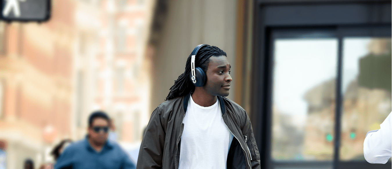Person using noise-canceling headphones for anxiety relief