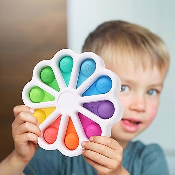 Colorful pop-it boards and silicone squeeze toys for tactile stimulation