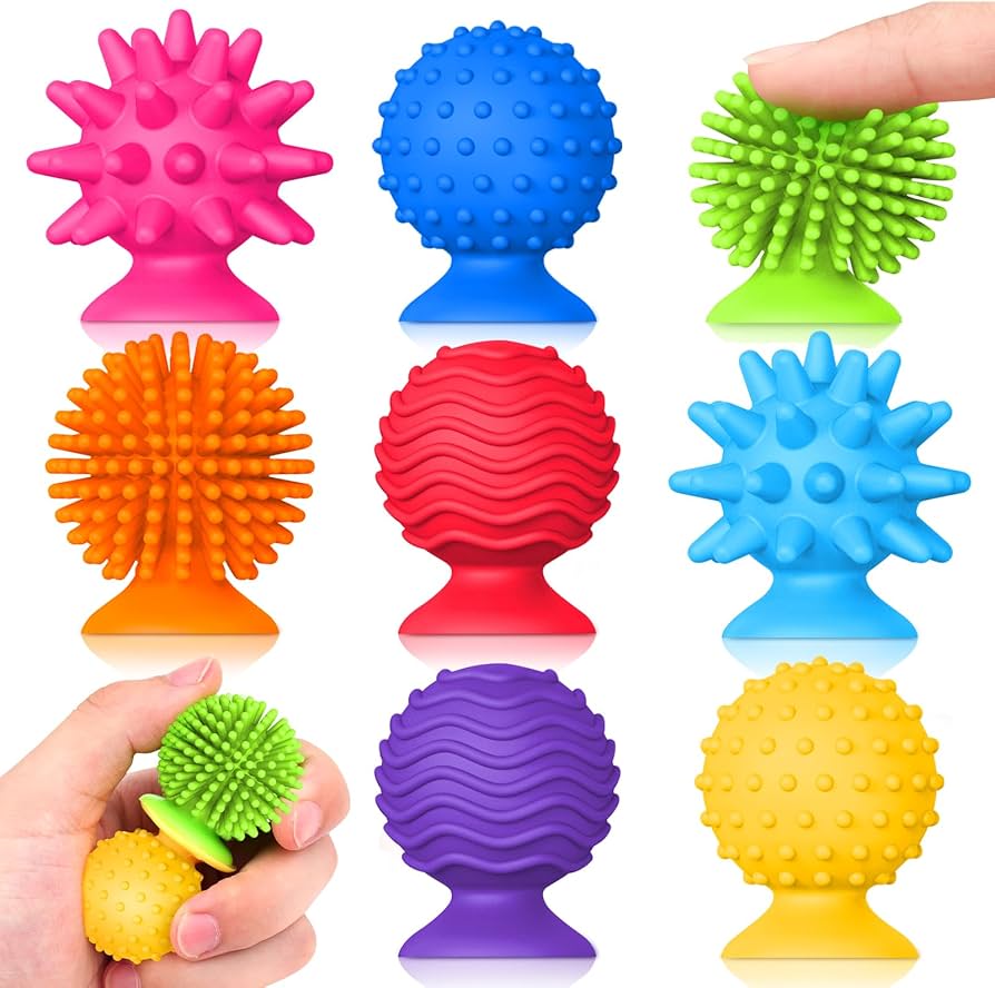 A collection of textured sensory balls and squishy toys in various shapes