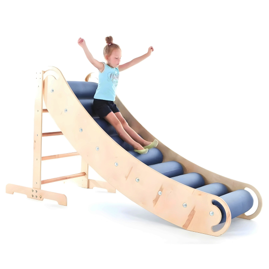 A child safely sliding down a indoor sensory slide