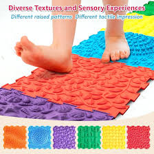 Interlocking foam floor mats with various raised textures for tactile exploration