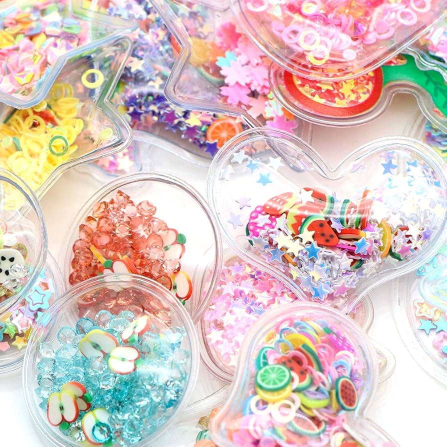 Set of transparent shakers filled with colorful beads and sequins