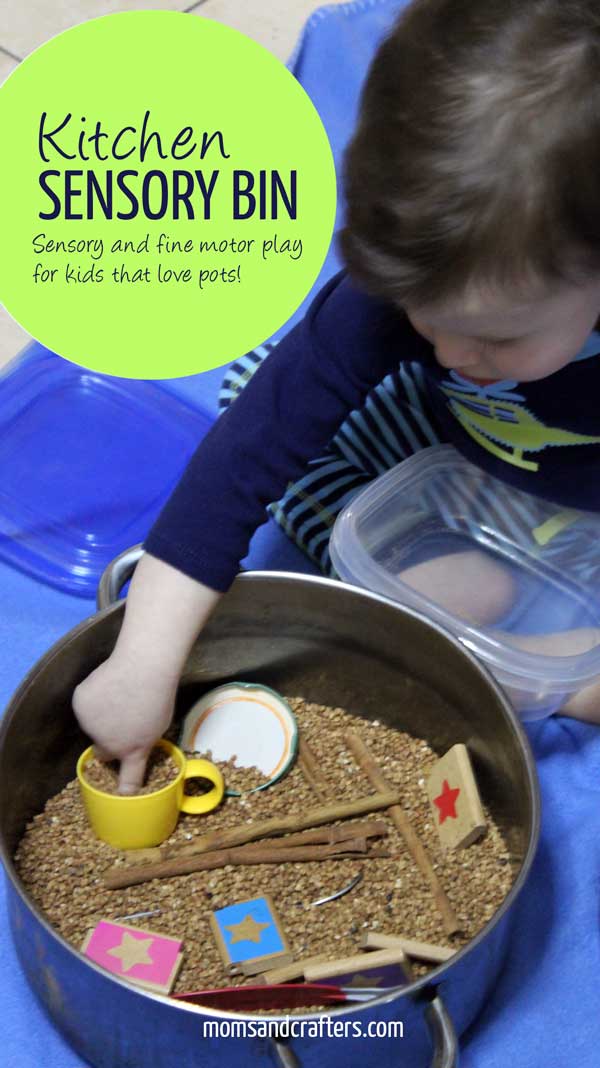 Toddler playing with kitchen utensils in sensory bin