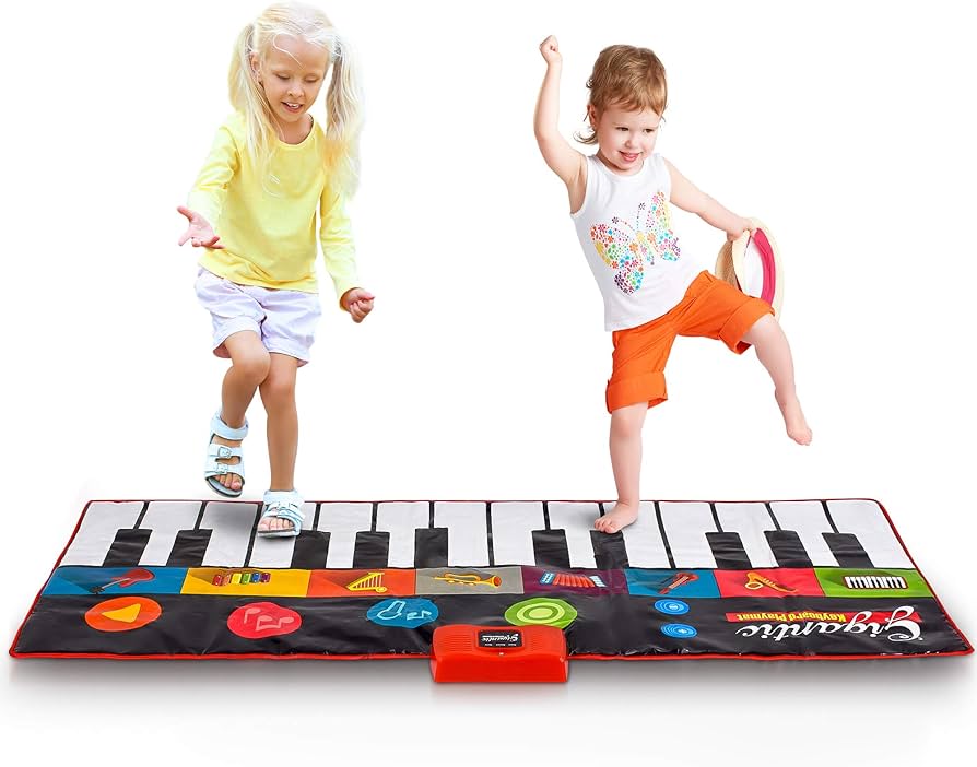 Child playing with oversized piano floor mat